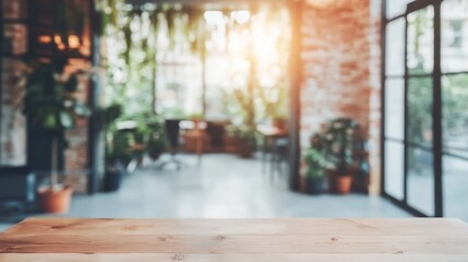 Bright and airy workspace with wooden table and lush greenery in the background during late afternoon sunlight