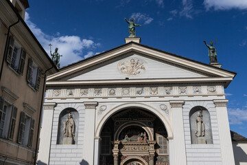 The Aosta Cathedral (Cattedrale di Aosta) 19th century facade in Piazza Papa Giovanni XXIII, Aosta Valley, Italy. Neoclassical architecture.