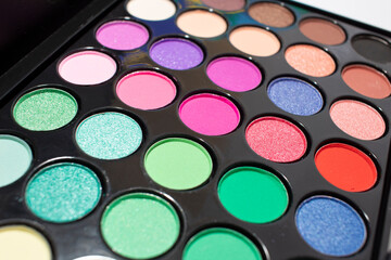 Rainbow colors eyeshadow palette close-up. Colorful shadow palette on white background