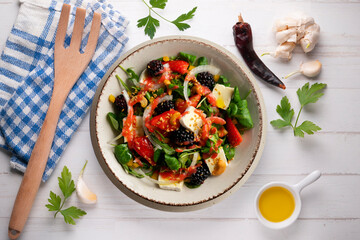 Healthy red berry and brie salad. Top view table with  decorations.