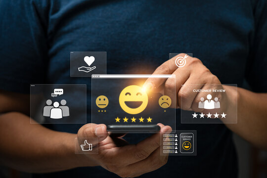 User Interacting with Mobile Device to Provide a Five-Star Customer Review, Featuring Digital Feedback Icons Representing Satisfaction Levels, Positive Consumer Experience, Online Service Platform