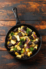Black pudding or blood sausage warm salad with vegetables