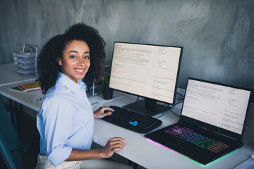 Photo of cheerful positive lady dressed shirt programming modern gadget indoors workplace...