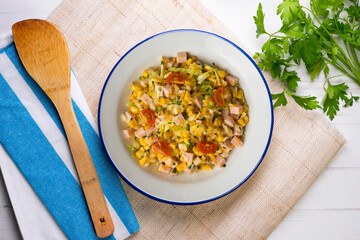 Healthy white cabbage, corn and turkey salad. Top view table with decorations.