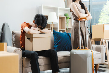 Unhappy young couple sitting apart, having problems in relationship, thinking of breaking up or divorce, upset, family lovers, man and woman avoid talking in relationship problems.