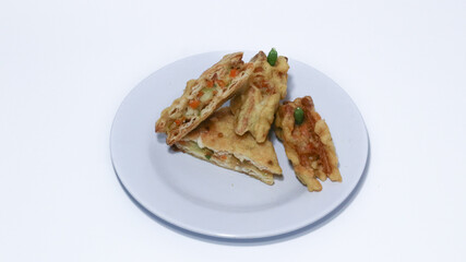 Roti Goreng is common fritter snack in Indonesia which made of white bread filled with creamy chicken and vegetable.