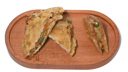 Roti Goreng is common fritter snack in Indonesia which made of white bread filled with creamy chicken and vegetable.