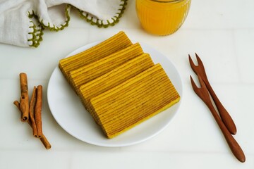 Delicious and delicate Indonesian Lapis Legit, a rich and buttery layered cake made with eggs,...