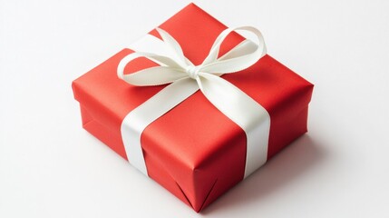 Bright red Valentine gift with a decorative white ribbon, isolated on a clean white background, representing love and affection.