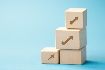 Obraz premium Stacked Wooden Cubes with Upward Arrows