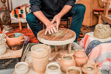 A person weaving a colorful, traditional rug on a loom, focusing on the craftsmanship.