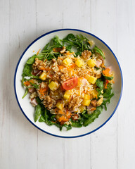 Healthy rice, pineapple and turkey salad. Top view table with  decorations.