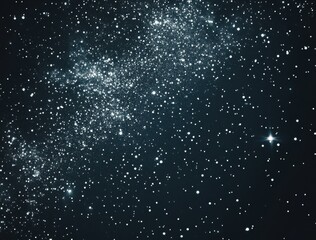 Obraz premium Black background with stars. White particles of space dust floating in the air