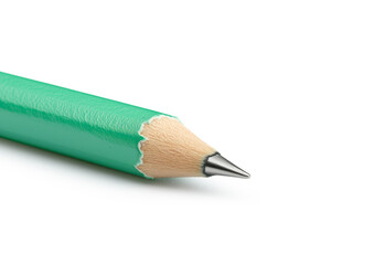 Green pencil with a sharp tip lying on a white background ready for drawing and writing tasks