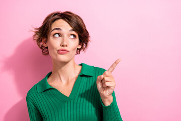 Photo of funky lovely girl with bob hairdo dressed green shirt indicating look at promo empty space...