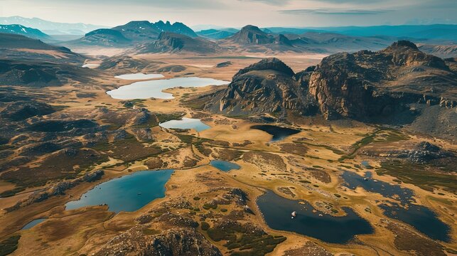 Expansive plateau with sparse vegetation rocky terrain and distant mountains