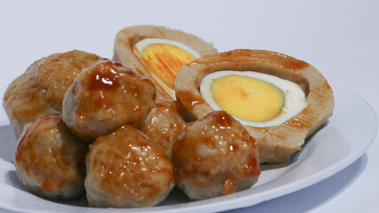 Pentol is a typical Indonesian spicy snack made from beef and tapioca flour.