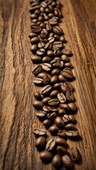Close-Up of Freshly Roasted Coffee Beans Forming a Thin Line on a Rustic Wooden Surface
