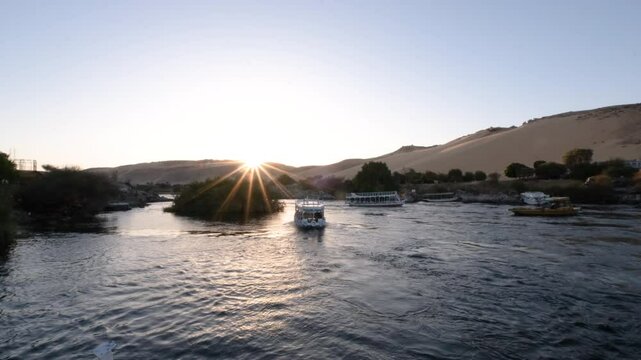 09/02/2024 ,Aswan Egypt, Tourist boats float on the Nile River, at Aswan Egypt