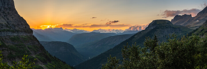 Panorama Of The Setting Sun Over The Mountains Surrounding McDonald Creek On The West Side Of Glacier