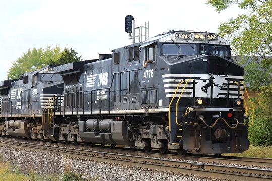 Diesel locomotive from Norfolk Southern Railway train hauling cargo. Fostoria, Ohio, USA - September 28.