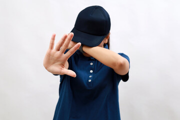 Young hispanic woman courier wearing delivery uniform and cap covering eyes with hands and doing...