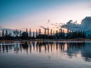 Naklejka premium The riverside of the Praek Tuek Chhu River in Kampot in Cambodia at sunset