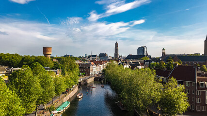 Fototapeta premium Utrecht town аerial drone view from above, typical Dutch city skyline, Utrecht cityscape with tower, canals and houses, Holland, Netherlands