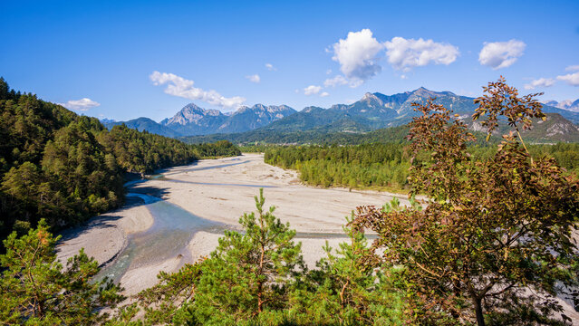 Panoramic view of Tagliamento river from a forest close to Villa Santina, Carnia, Udine province, Friuli Venezia Giulia, Italy. Mountain river with Julian alps in background.