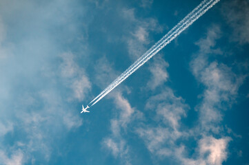 Trail clouds formed by aircraft in the sky