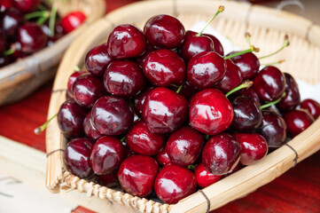 Fresh and plump cherries in the basket