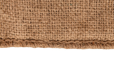 Burlap texture. A piece of torn burlap on a white background. Canvas. Packing material