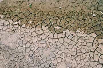 The clay floor is cracked because of the extreme hot weather