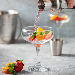 Homemade red wine sangria with orange, apple, strawberry and ice in glass