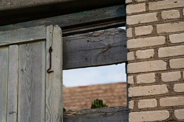 The doors of the back entrance to an abandoned, rustic store