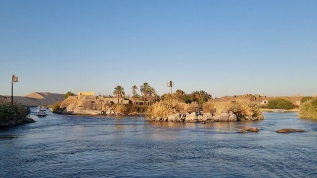 09/02/2024 ,Aswan Egypt, Tourist boats float on the Nile River, at Aswan Egypt