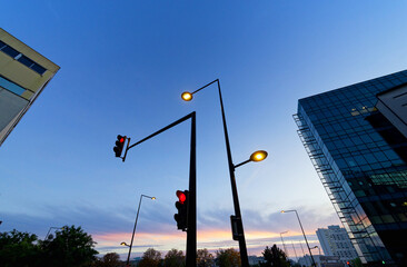 Red light and street lights during the blue hour in Paris suburb. Ivry-sur-Seine city