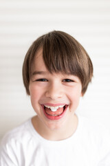  Smiling boy with a pill. Medicine concept