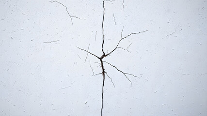 Textured background photograph of a white concrete wall. In the center is a large impact crack from being hit by a fist. Grunge. Debris. Wallpaper. Generative AI