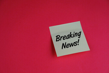 handwriting of breaking news on red background