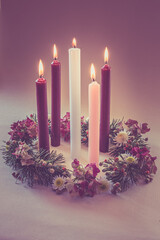 advent decoration, wreath with 5 candles, pink, purple and white colors, isolated, 5 five candles burning