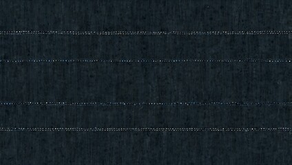 Blue denim background dotted with various sizes of dots