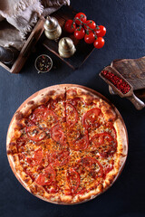 Pizza margarita.Top view. Vertical photo.