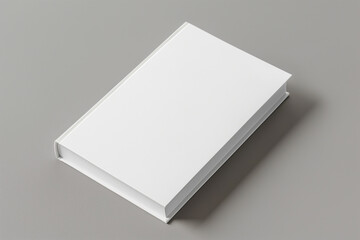 White hardcover book with blank cover on a plain minimalist gray background