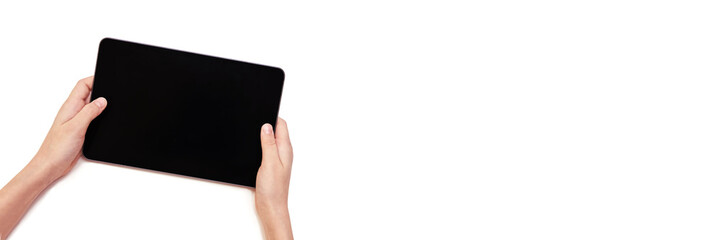 Minimalist technology concept: hands holding a tablet with blank screen for app design or presentation mockup. Horizontal banner