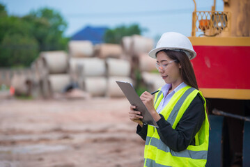 Asian engineer working at site of a large building project,Thailand people,Work overtime at construction site