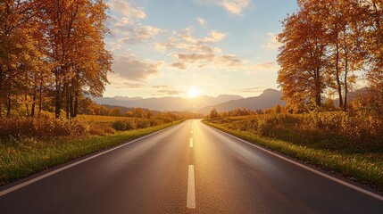 Fototapeta premium A road with trees on either side and a sun setting in the background. The road is empty and the sun is setting, creating a peaceful and serene atmosphere