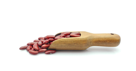 Red kidney beans with wooden scoop isolated on white background
