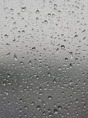 Water Droplets on Glass During a Downpour