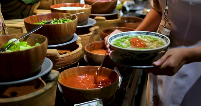 scoop sauce with a spoon buffet in a restaurant close-up ketchup scoop with a large tablespoon